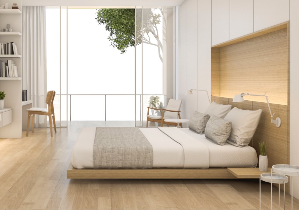 A furnished bedroom with a platform bed and headboard made from laminate by Genesis Products