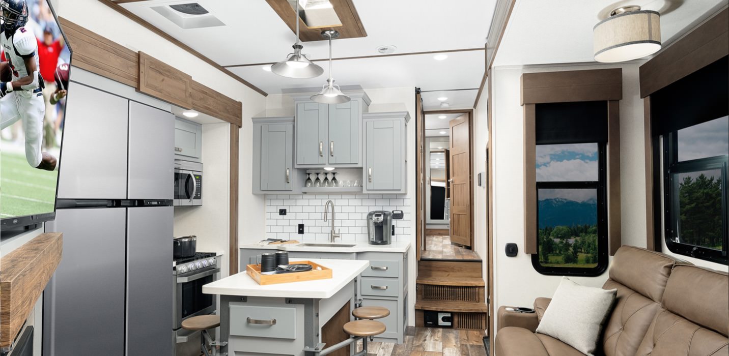 Interior of an RV home furnished with laminate cupboards and counters