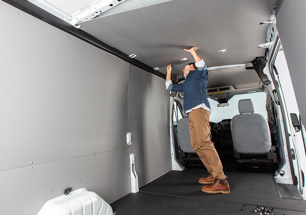 A many installs custom Genesis Products panels inside of a van