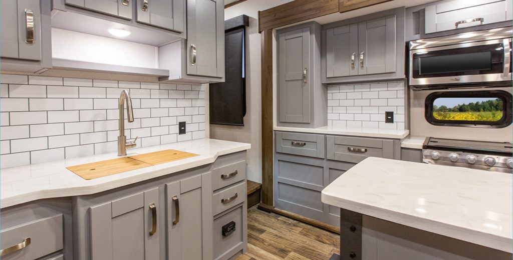 A sample kitchen with laminate cupboards and molded island countertop