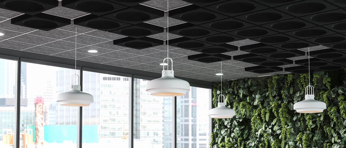 office ceiling with acoustic tiles to reduce noise